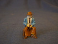 PAINTED PEWTER OLDER MAN SITTING ON CRATE HOLDING DRINK O GAUGE