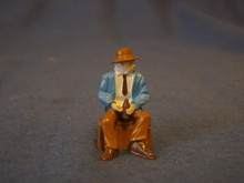 PAINTED PEWTER OLDER MAN SITTING ON CRATE HOLDING DRINK O GAUGE