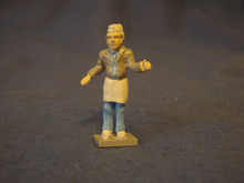 PAINTED PEWTER VENDOR WITH HAT AND APRON O GAUGE