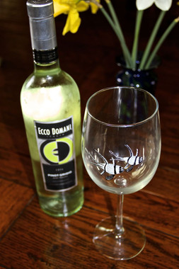 The handpainted wine glass is a 19-ounce wine glass and stands 9 inches tall. 