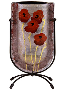 Glass Bud Vase with red flowers over metallic coloring