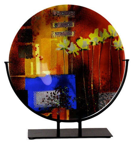 15" red fused art glass round platter, featuring a blue blocking, orange and black details and yellow flowers