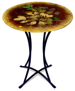 Autumn Leaves in gold bronze and green are delightfully added atop  a muted red bordered by gold in this cafe table