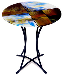 Hand painting is featured on this contemporary fused glass cafe table in hues of red, brown, black, white and blue.  Gold highlights added for detail