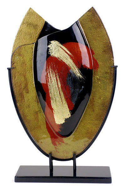 21x14 inch oval fused glass platter featuring gold and black, with hand painted red and gold, broad brush strokes
