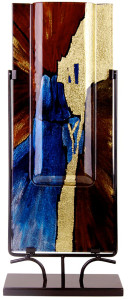 This is a 24x10in fused glass vase, featuring splahes of blue, brown and black, along with gold.  Speedy