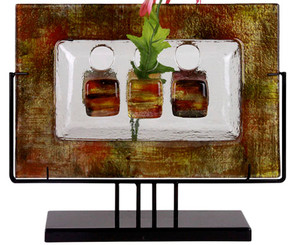 A wonderful fused glass art creation.  A vase featuring side openings, in clear glass, with gold and red details. New concept series. Stand included.
