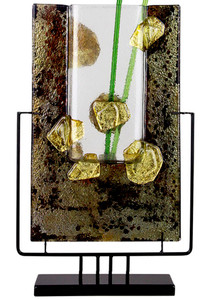 This rectangular fused glass vase features gold nuggets and a few green stems.  Stand included