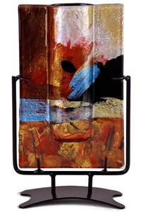 This 10 inch x 5 inch wide, rectangular bud vase incorporates fused glass with red, blue, yellow gold and black.  In the Horizon series. Stand included
