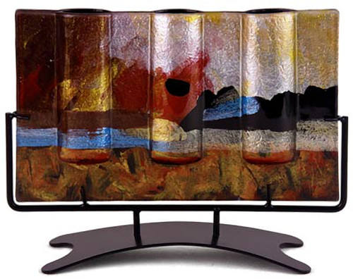 This 12 inch x 5 inch wide, rectangular triple bud vase incorporates fused glass with red, blue, yellow gold and black.  In the Horizon series. Stand included