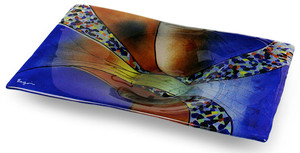 A colorful fused glass platter in blue and orange, with multiple additional colors.  In our Sky Bridge series!