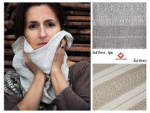 This scarf is woven on white, as pictured on the bottom right-hand-side.