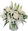 Fresh white lilies; white roses and fresh greens