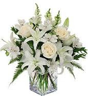 Fresh white lilies; white roses and fresh greens