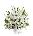 This arrangement uses white flowers, accented with a gorgeous assortment of lush greens, in a brilliant expression of peace and soft serenity