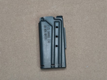 Left side of magazine, view holes at 3, 5 and 7 rounds. Laser marked with compatible model