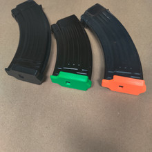 Floorplate caps of different color on several surplus and commercial AK-M magazines