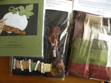 The complete kit with pattern, all the felted wools including the background, all the hand-dyed variegated threads including the corn kernels, freezer paper and the cotton pillow backing fabric.
