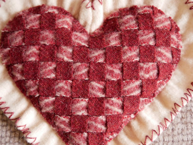 This kit makes  this one block, finished at 10" x 10" (a little larger than the size of the block within the quilt.)  This woven heart is  easy to make with our detailed instructions!  And, it could be a great bowl filler or ring bearer's pillow for a wedding!  Just add a ribbon to attach the rings!