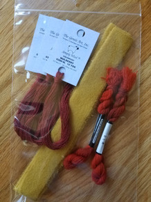 A total of 5 skeins of 2 different wool threads, to complete 2 bittersweet vines, plus the felted gold wool for the berries' husks.