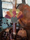 Hodges the turkey, from Fall Harvest wool applique pattern, displayed as a "taper topper", in our rusty candle stand.  In the bowl, there are also some rusty stars and bells, available as our "Rusty Embellishments" package.