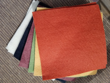 This is a bundle of 12, 6" squares of American-made 100% wool felt.  These are non-woven fabrics.  There are 2 squares in each of 6 colors! 
These are the PRIMITIVE colors used in the cover art of our Happy Fall pattern!  
There is also a more traditional, bright combination!