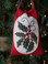 "Holly" hangs amongst the boughs and lights!  "Mistletoe and Holly" by Meetinghouse Hill Designs.
Back the appliqued and embroidered oval with another layer of wool for an oval shaped ornament - then use a small fabric sack to gift the ornament in!