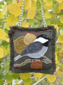 Make Chester the chickadee into a door hanger, ornament or pin cushion!  Kit includes pattern, felted wools, hand-dyed applique threads, green prairie cloth background and backing, freezer paper and ribbon hanger.  