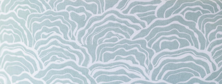 Named for the diverse beauty of the Carolinas, the print is reminiscent of ocean waves and oyster shells along the coast, and the lichen of the rich mountain forests and bogs.