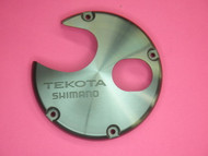 SHIMANO TGT0544 & 10NV3 LEFT SIDE PLATE COVER FOR TEKOTA 300LC, 300LCM,  500LC, 500LCM,  600LC, & 600LCM
