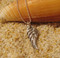 Angel Wing Charm handmade from reclaimed pure silver by U.S. artist Tracy Menz.