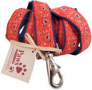 Warm orange floral ribbon embellishes our hemp dog leashes.