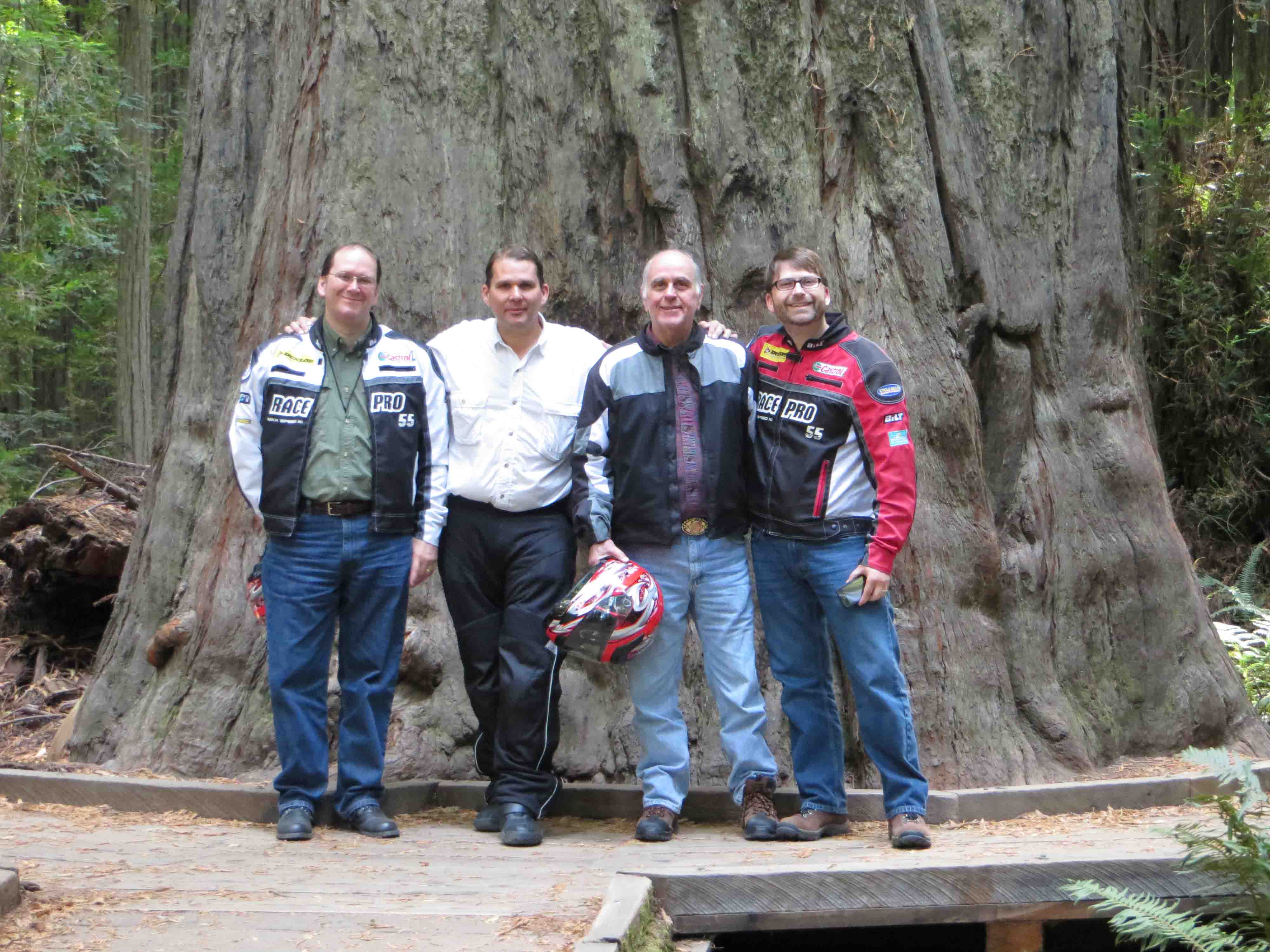 Family in front of giant redwood tree