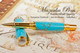 Handmade Rollerball Pen handcrafted from Turquoise TruStone with Gold and Chrome finish.  Tip view of pen.