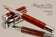 Handmade wood pen made from Amboyna Burl.  Handcrafted pen by our artist.  View of pen.