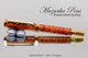 Handmade wood pen made from Amboyna Burl.  Handcrafted pen by our artist.  View of pen.