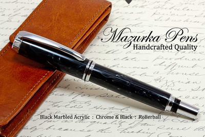 Handmade acrylic pen made from marbled black acrylic.  Handcrafted pen by our artist.  Main iew of pen cap.