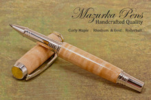 Handmade Rollerball Pen made from Curly Maple with Rhodium and Gold trim.  Handcrafted pen by our artist.  Tip view of pen cap.