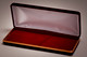 Brown velvet pen and pencil case with gold trim, red velvet interior, show open