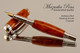 Handmade Rollerball Pen made from Amboyna Burl with Rhodium and Gold trim.  Handcrafted pen by our artist.  Side view of pen cap.