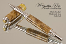 Handmade Rollerball Pen made from Black Ash Burl with Rhodium/Gold color trim.  Handcrafted pen by our artist.  Side view of pen cap.
