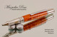 Handmade Ballpoint Pen made from Amboyna Burl with Stainless Steel finish.  Bottom view of pen.
