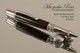 Handmade Ballpoint Pen made from Black / Brown Ebonite with Stainless Steel finish.  Tip view of pen.
