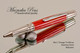 Handmade Ballpoint Pen made from Red and Orange TruStone with Stainless Steel finish.  Tip view of pen.
