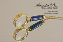 Hand Made Pendant made from Blue Sea Resin with Gold color finish.  Side view of pendant.