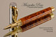 Handmade Rollerball Pen made from Desert Ironwood Burl with Gold colored finish with Chrome Accents.  Main view of pen.