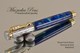 Handmade Rollerball Pen made from Planet Earth Resin with Chrome finish / gold colored accents.  Top view of pen.