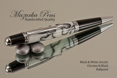 Handcrafted pen made from swirling White and Black Acrylic with Chrome finish and Black accents.  Handcrafted pen by our artist.  Top of the pen,