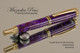 Handmade Rollerball pen made from Purple Wood Chip Resin with Gold color finish / black accents.  Handcrafted pen by our artist.  Top view of pen tip.