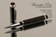Handmade rollerball pen made from Faux Leather with Chrome / Black finish.  Handcrafted pen.  Cap view of pen - Stock Picture